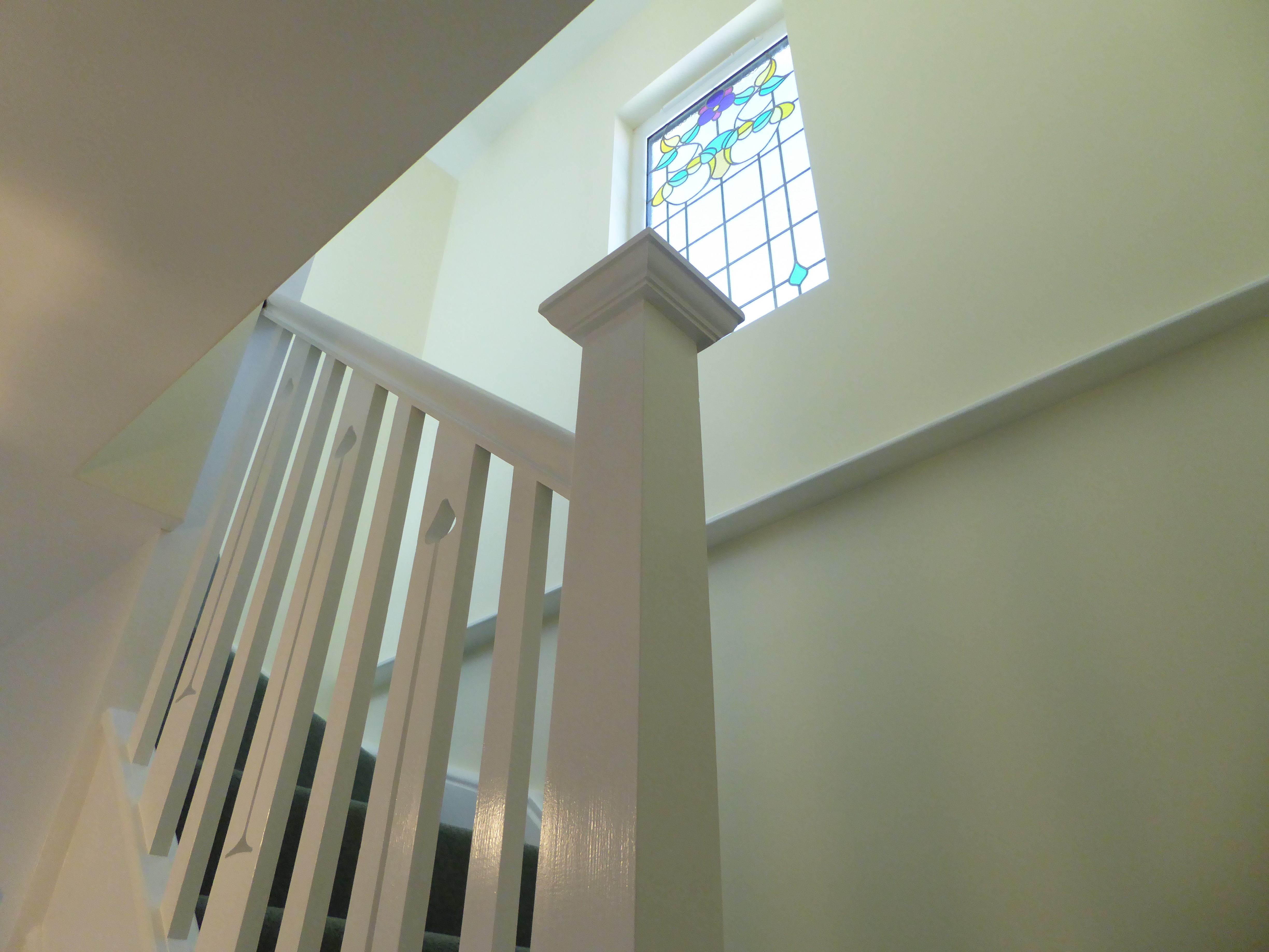 Stairs with stained glass window